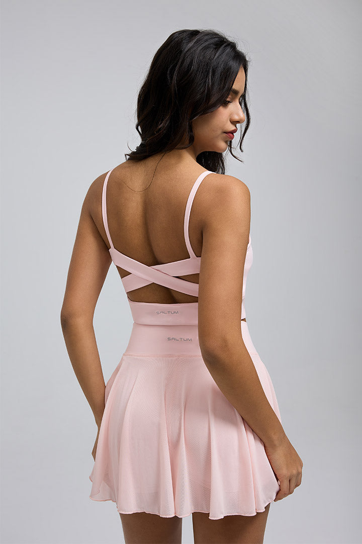Soutien-gorge de sport croisé et jupe plissée en résille transparente